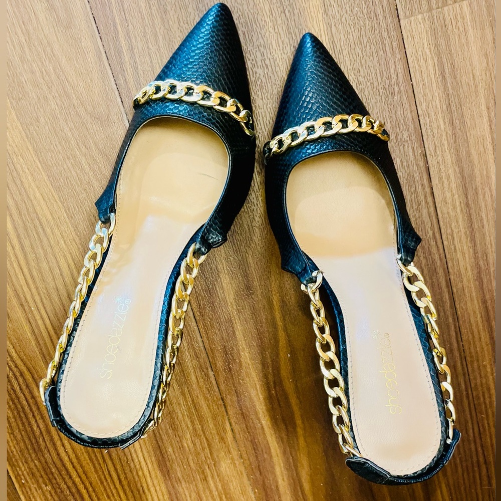 Sophisticated black faux fur ridged black sling back heel with gold chain